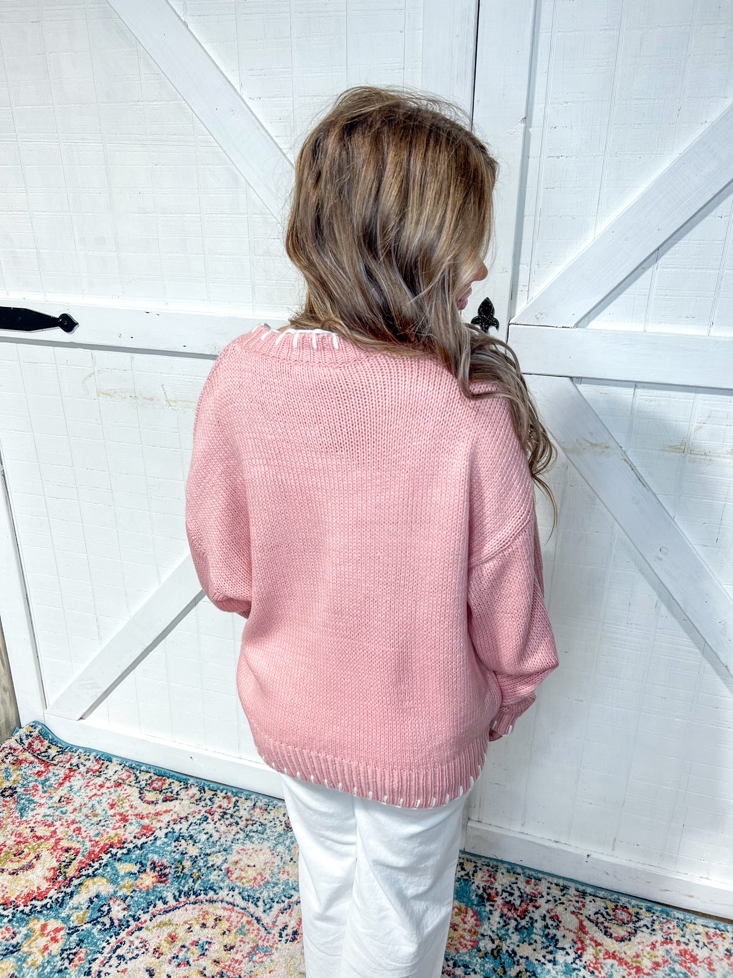 Photo of the back of our pink long sleeve sweater