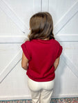 Photo of a woman modeling the back of this burgundy top.