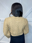 Photo of the back of this tan cardigan. The bows are only on the front.