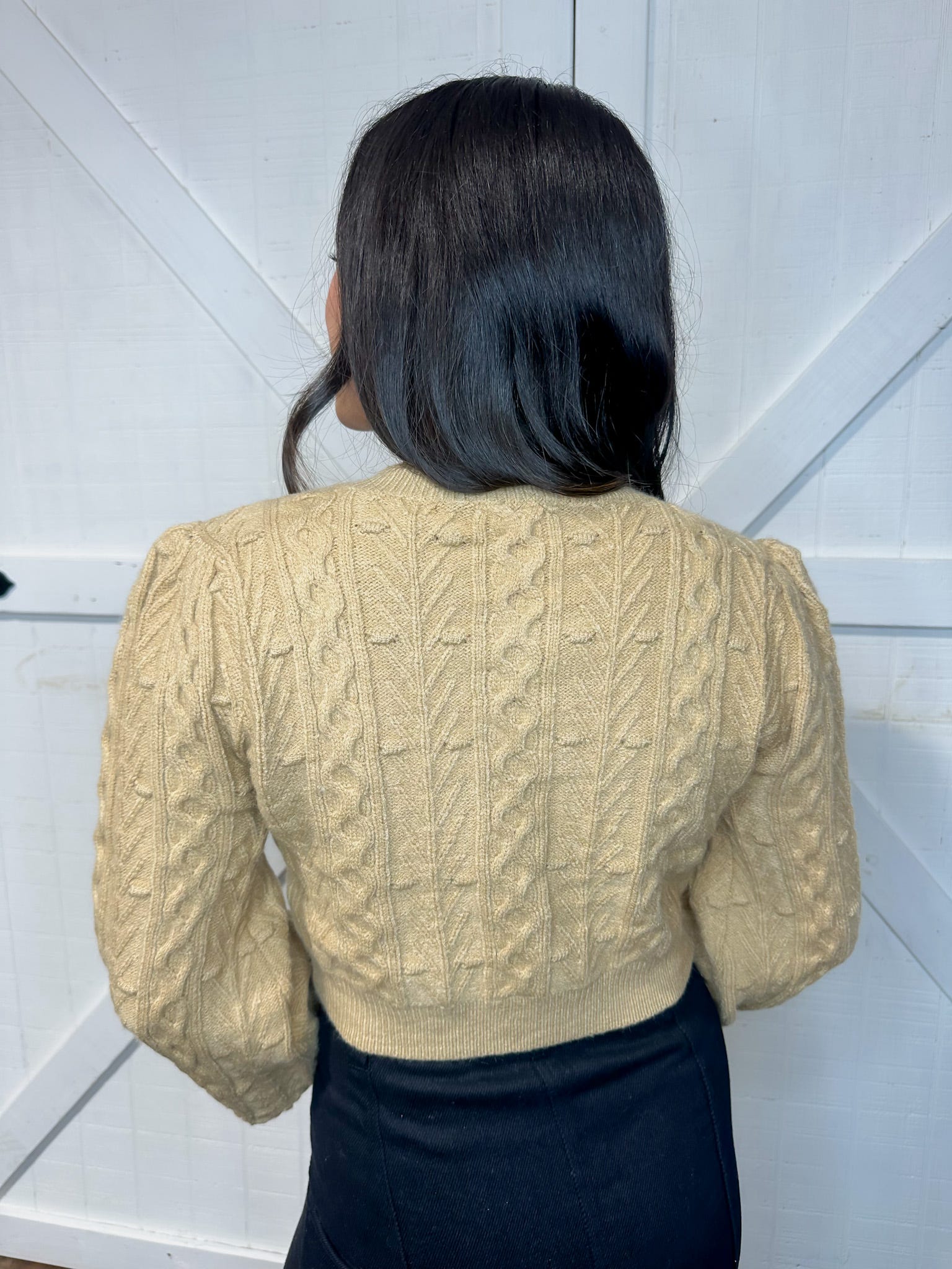 Photo of the back of this tan cardigan. The bows are only on the front.