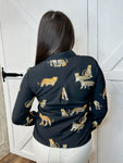 Young woman modeling the back of our black, button down, long sleeve blouse with cheetah animals all over.