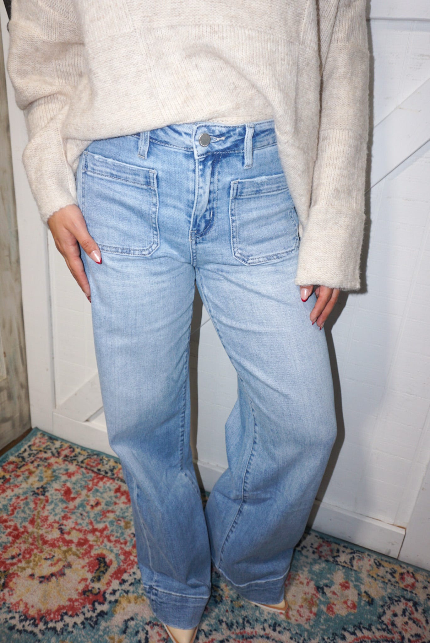 A closer photo of our light denim, wide leg jeans with patch pockets on the front (normal pockets on the back also)