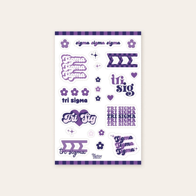 Up close photo showing a sheet of nine Sigma Sigma Sigma stickers along with 13 flowers and stars all in different shades of purple