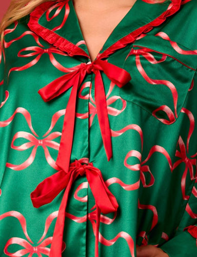 Up close photo of the red bow design and the red satin bows that tie in front