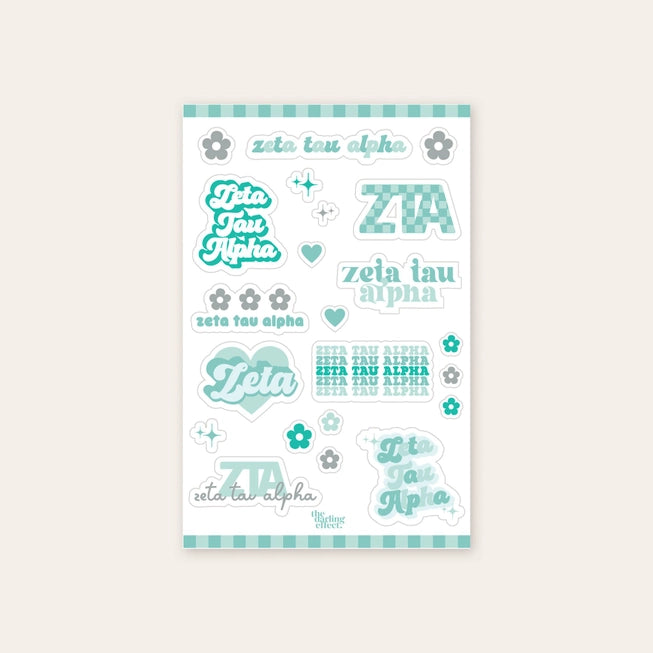 Up close photo showing a sheet of nine Zeta Tau Alpha stickers along with 13 flowers and stars all in different shades of turquoise