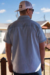 Photo of the back of this light washed denim pearl snap button up short sleeve shirt